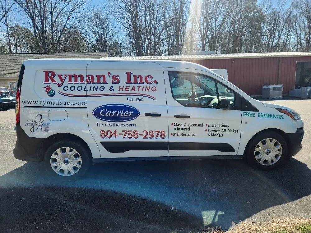 A white van with the words ryman 's inc. Cooling & heating on it
