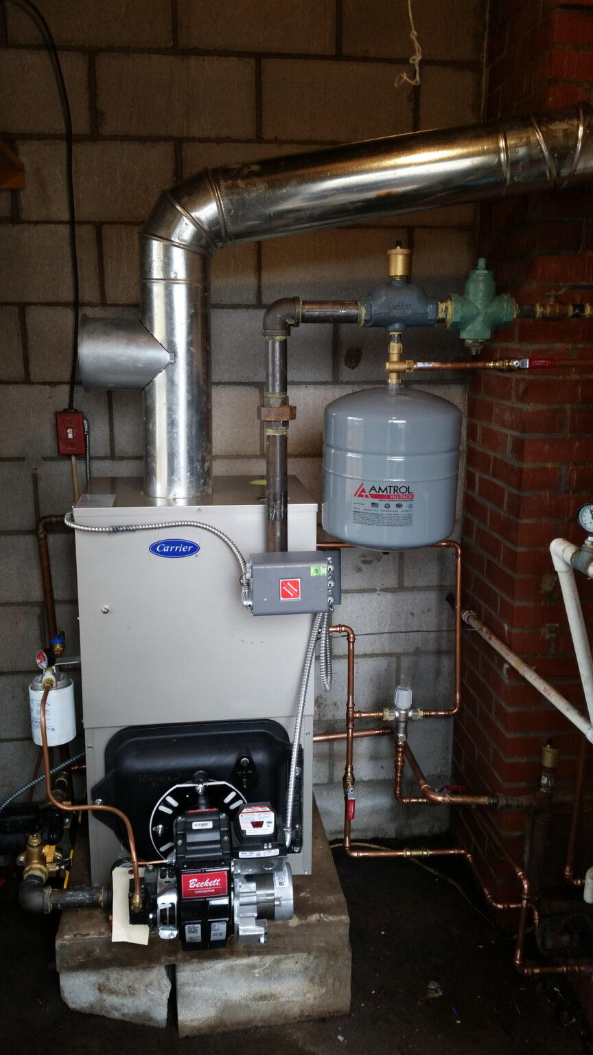 A gas boiler and water heater in a basement.